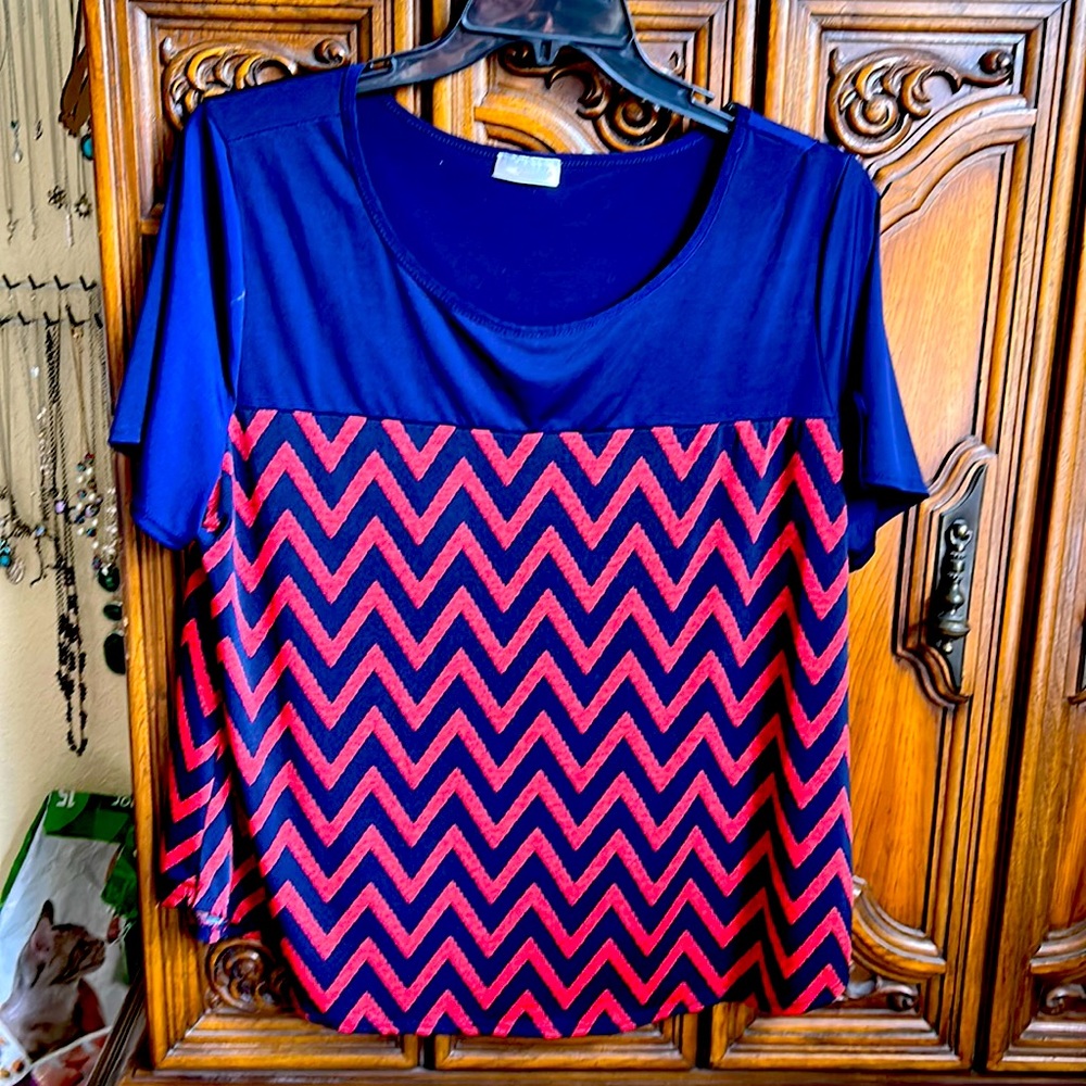 Navy and reddish/orange blouse.